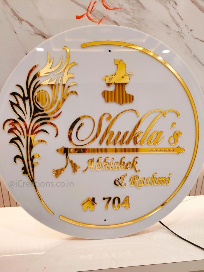 a circular sign with gold text and a peacock feather