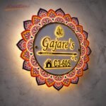 Mandala name plate with warm LED glow at night