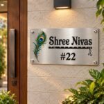 House name board (8x16 inch) in silver stainless steel, on an outdoor home entrance
