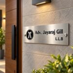 Name plate for office (4x12 inch) in silver stainless steel, mounted on a wall