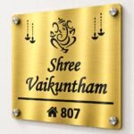 Customised name plate for home in golden brushed stainless steel, 12 by 12 inches, angled product view