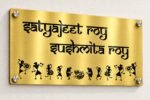 Name plate for home in golden brushed stainless steel, 8 by 16 inches, angled product view